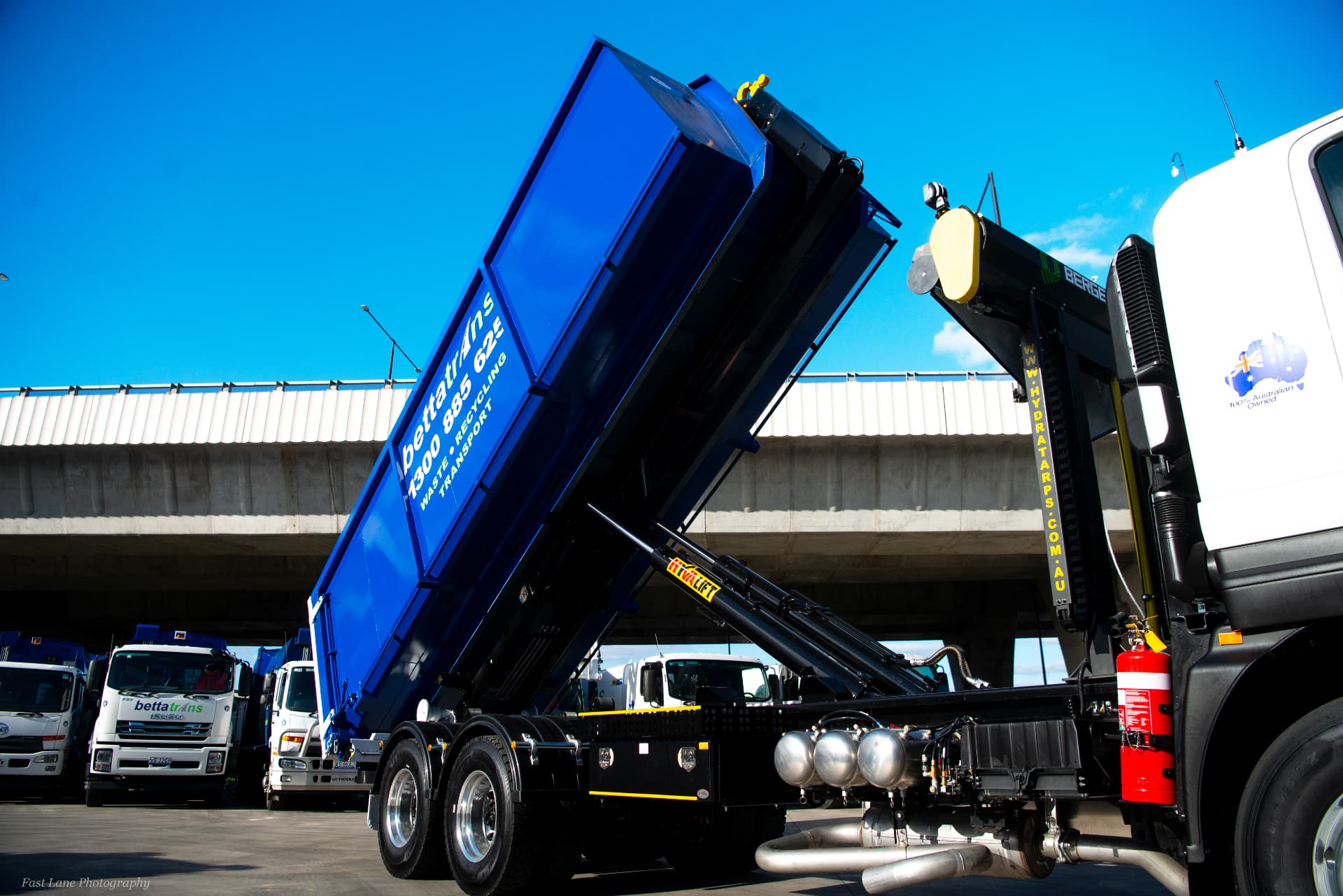 Bettatrans hooklift truck delivering a hook bin